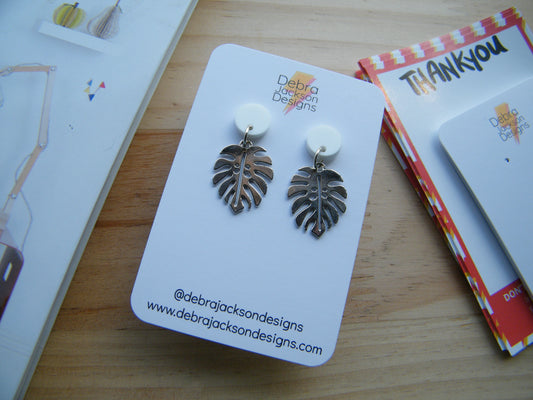 White and silver monstera earrings