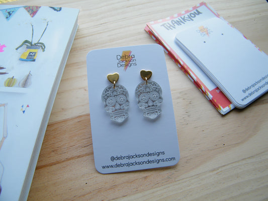 Gold and silver skull earrings