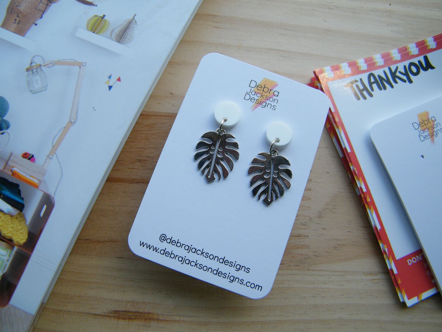 White and silver monstera earrings