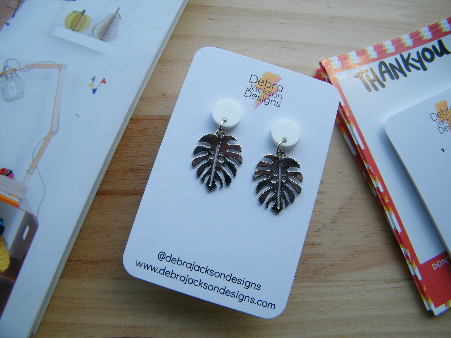 White and silver monstera earrings