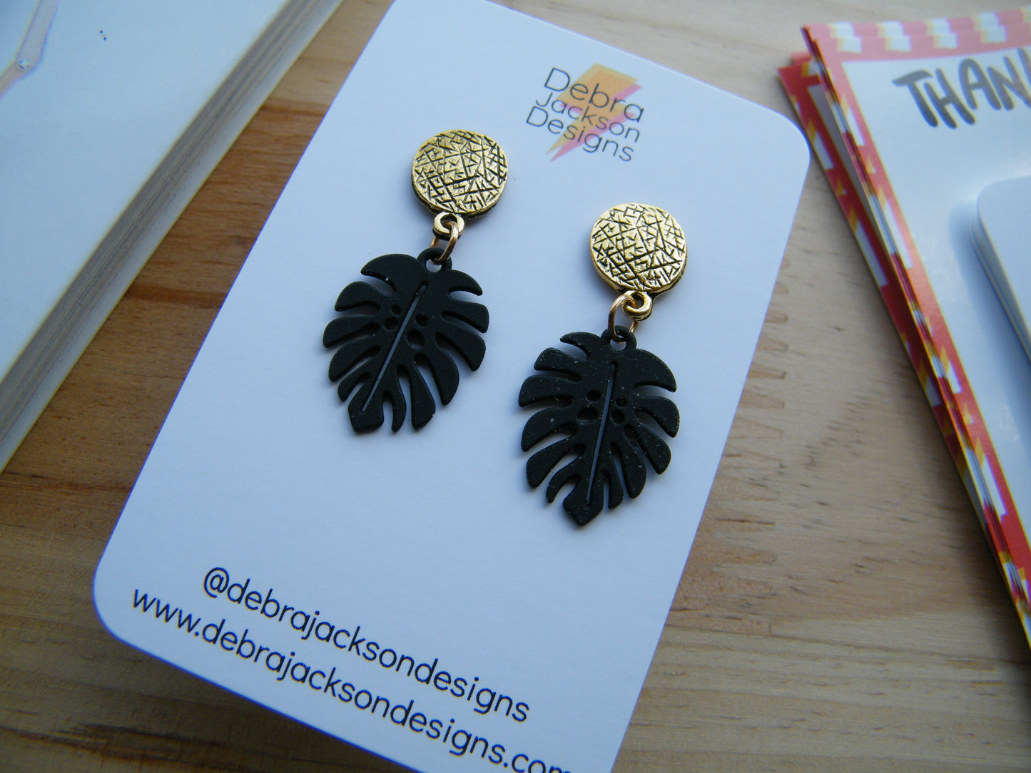 Black and gold monstera earrings