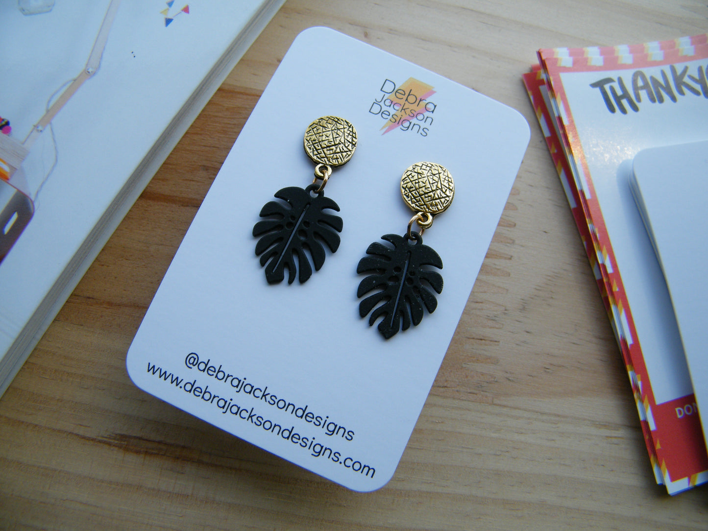 Black and gold monstera earrings