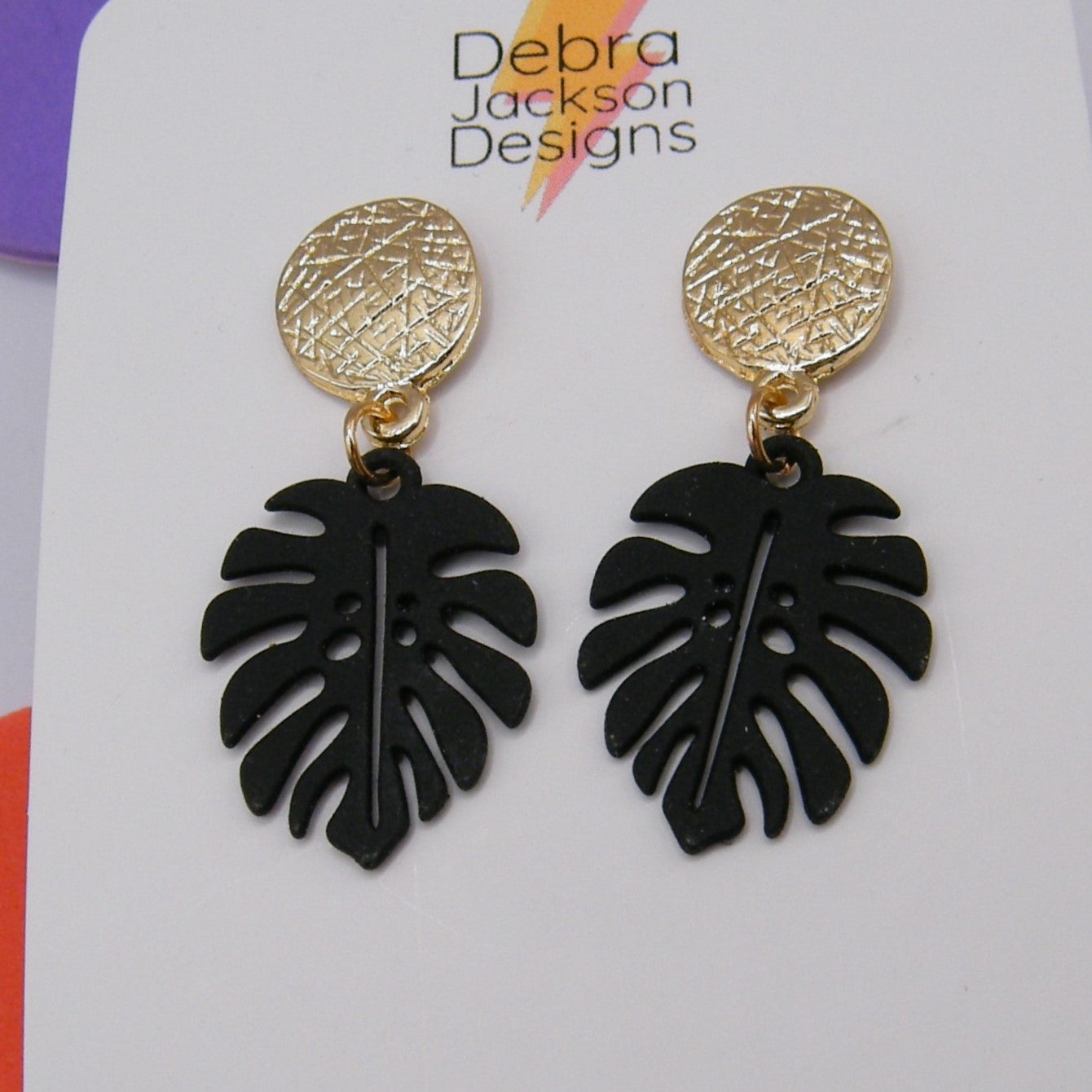 Black and gold monstera earrings