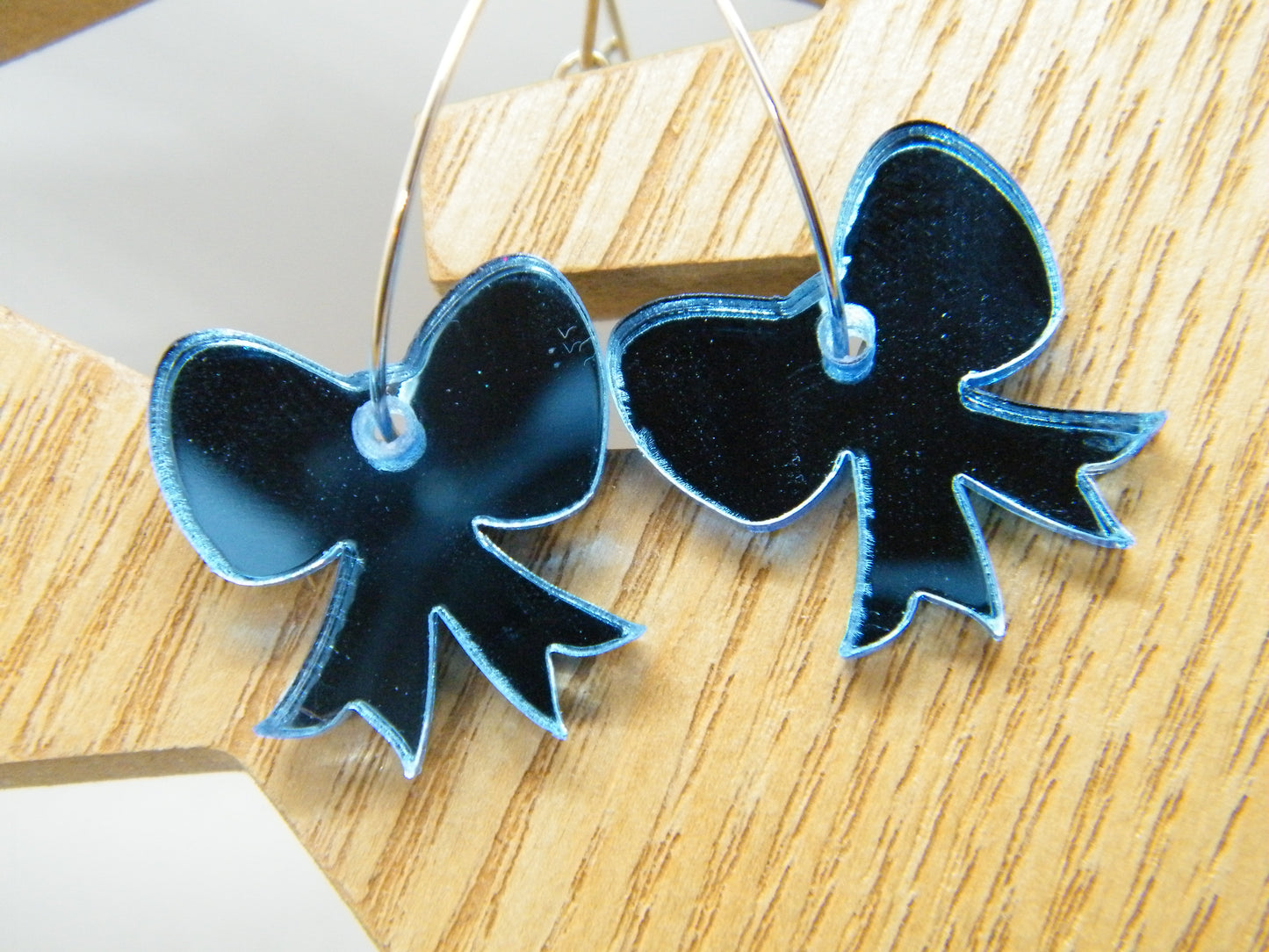 Blue mirrored bow hoops