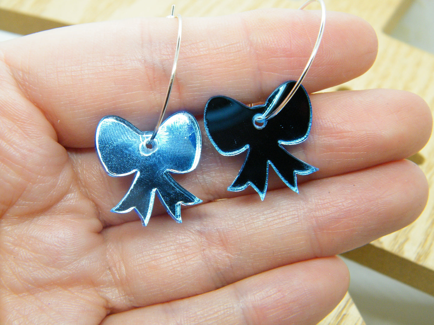 Blue mirrored bow hoops